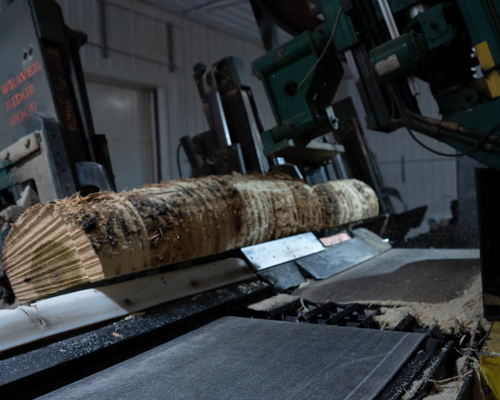 Amish Builder Millcraft Furniture Factory Measuring and Cutting Logs